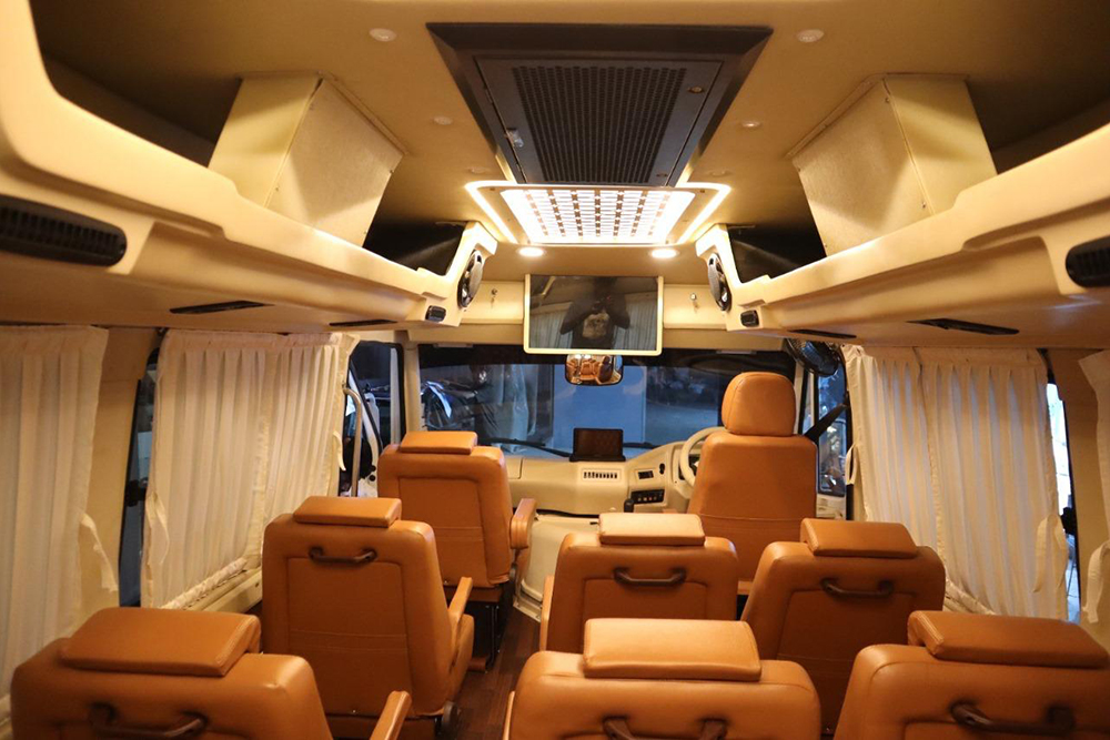 Luxury 9-17 seater Tempo Traveller interior with comfortable AC seating